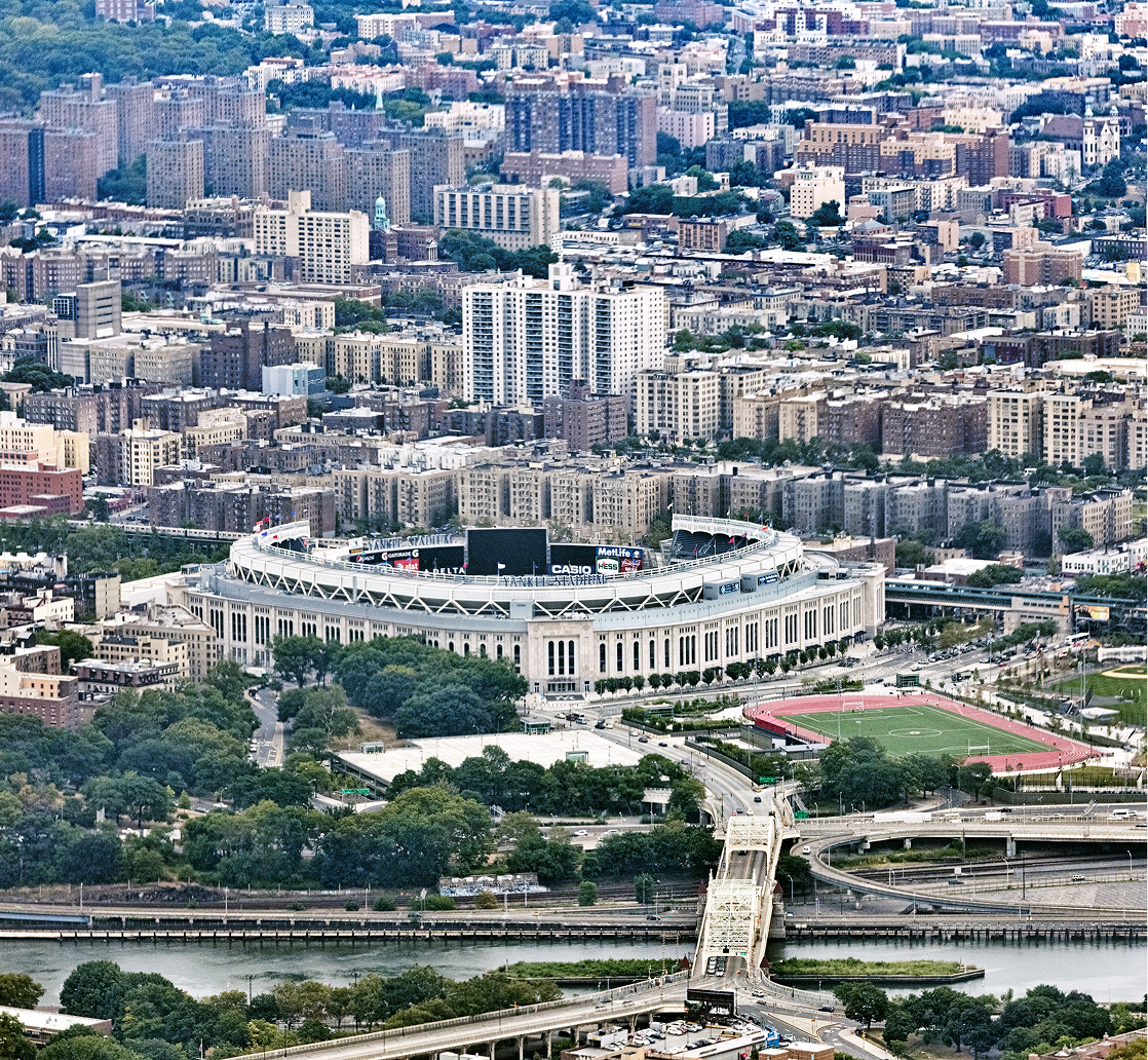City skyline featuring large circular stadium