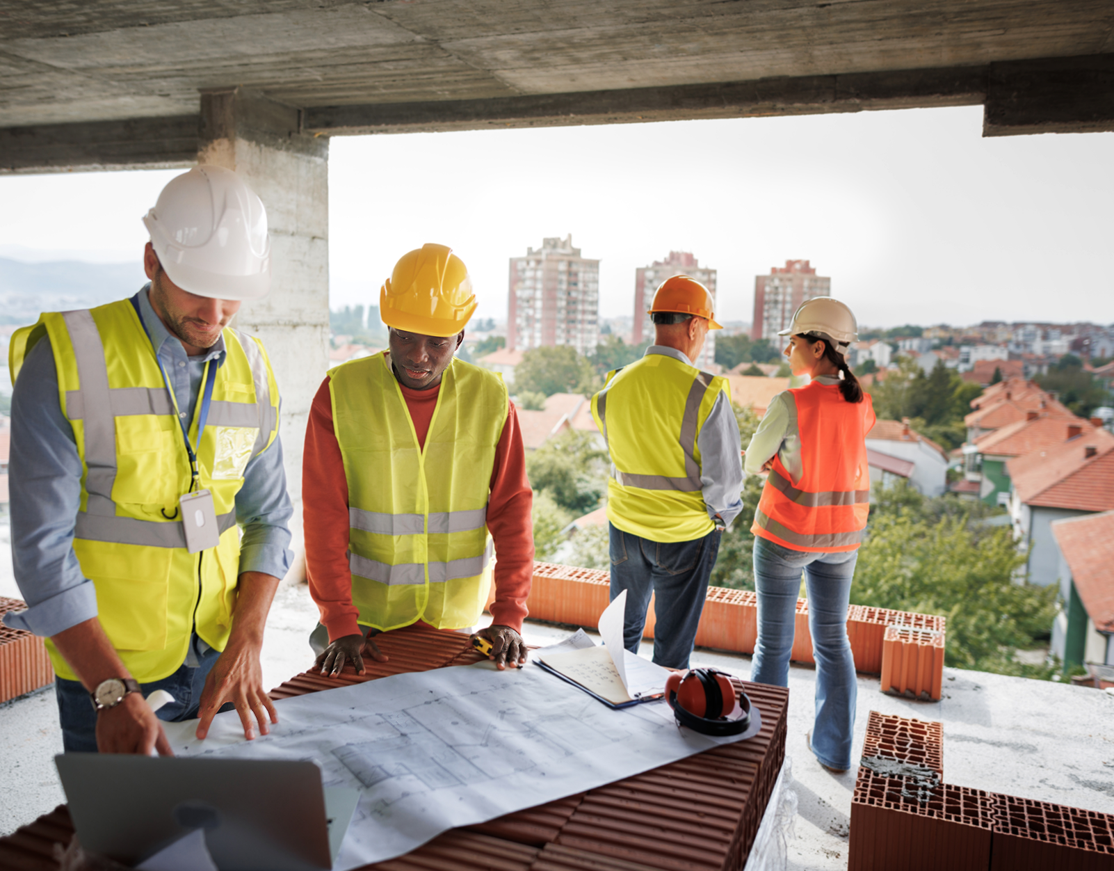 Construction team reviewing building plans