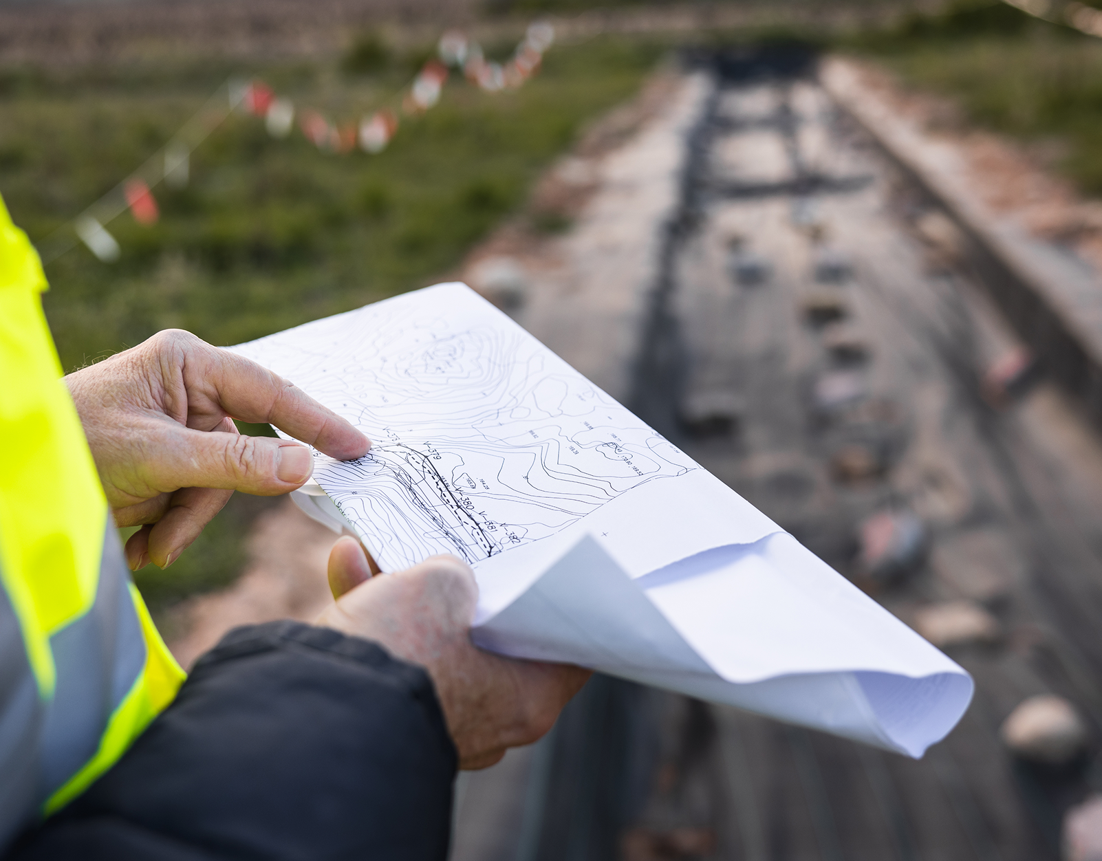 Surveyor analyzing site plans