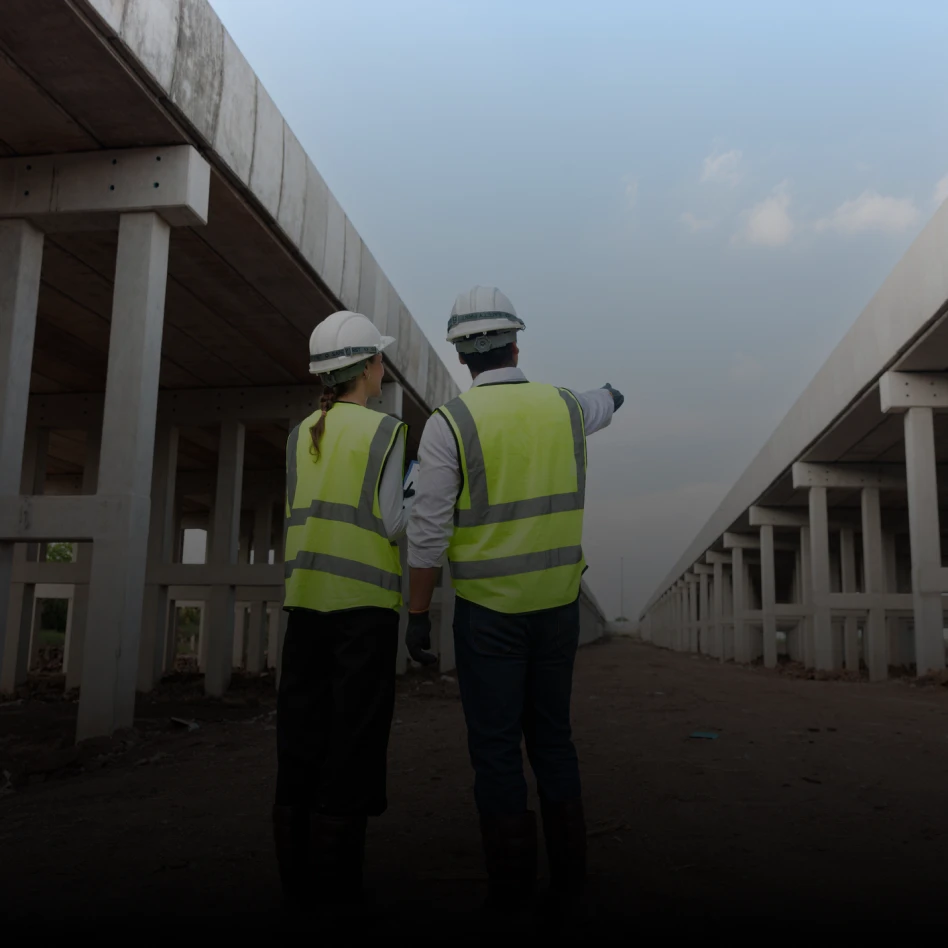 Two engineers discussing bridge project